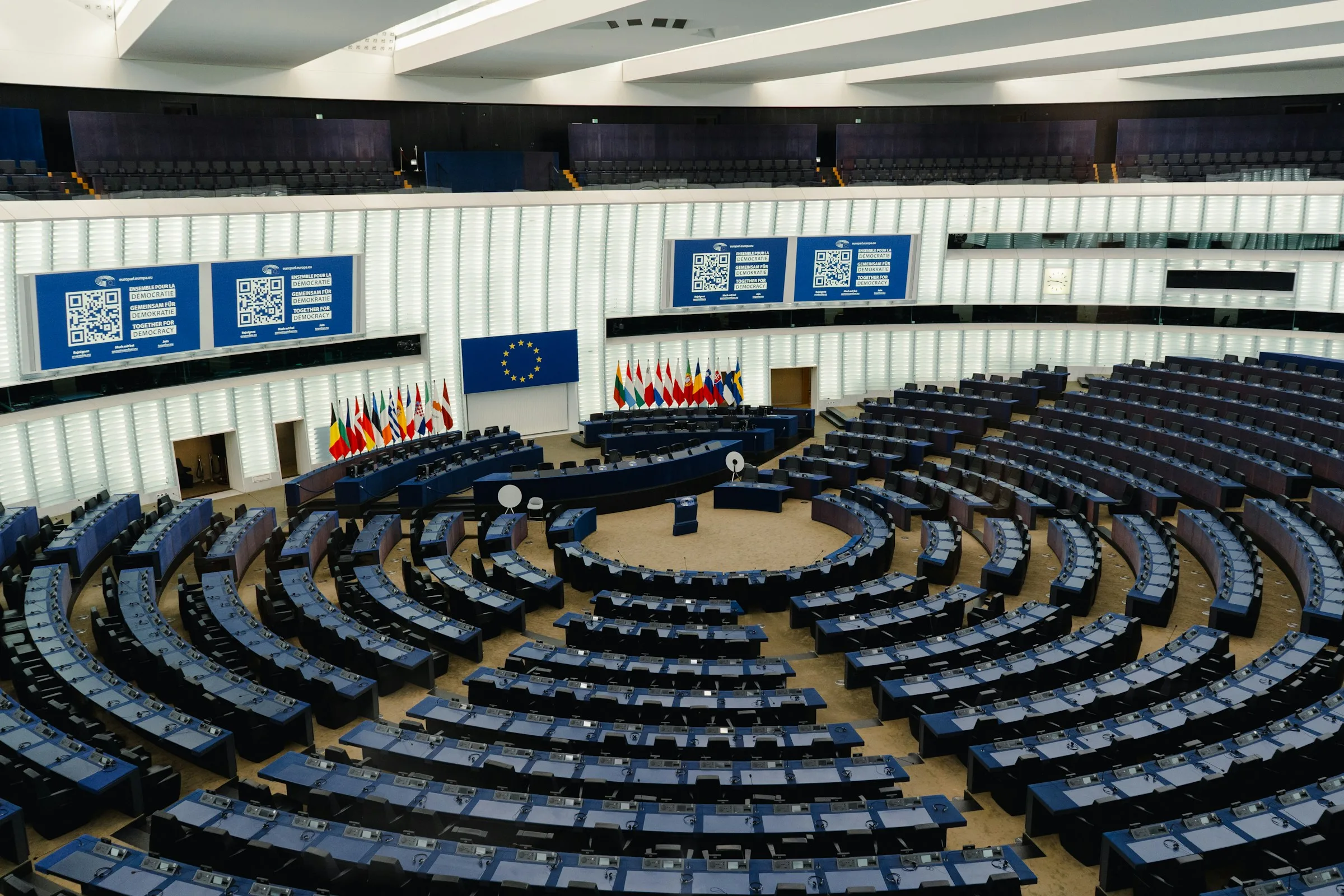 European Parliament plenary chamber with delegate desks